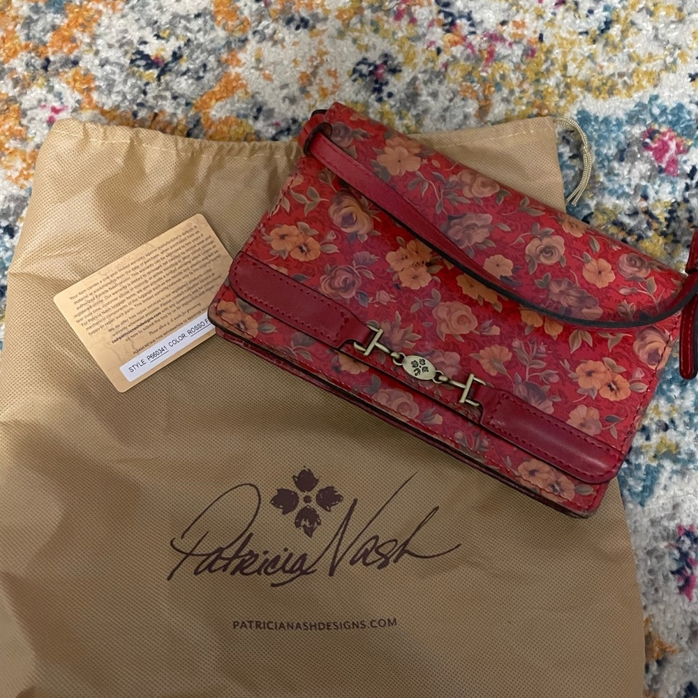 Red floral pattern Patricia Nash bag with dust cover